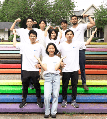 Group of WMDD students forming a heart shape on stairs to show unity